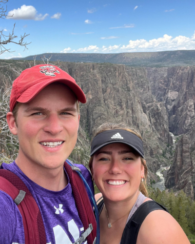 A young couple take a selfie during a hike.