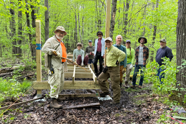 A boardwalk building crew proudly stands by their work. Photo by Miranda Murphy.