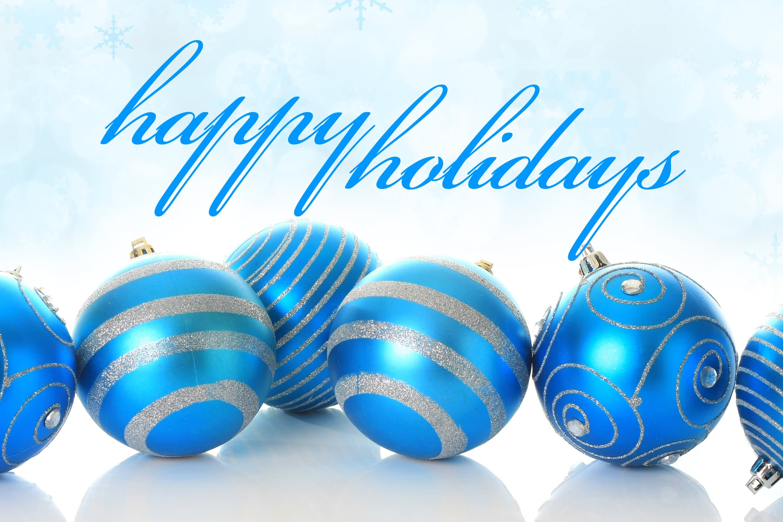 Beautiful ornaments in different shades of blue adorn this message for happy holidays.